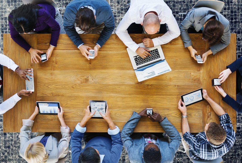tech users round a table