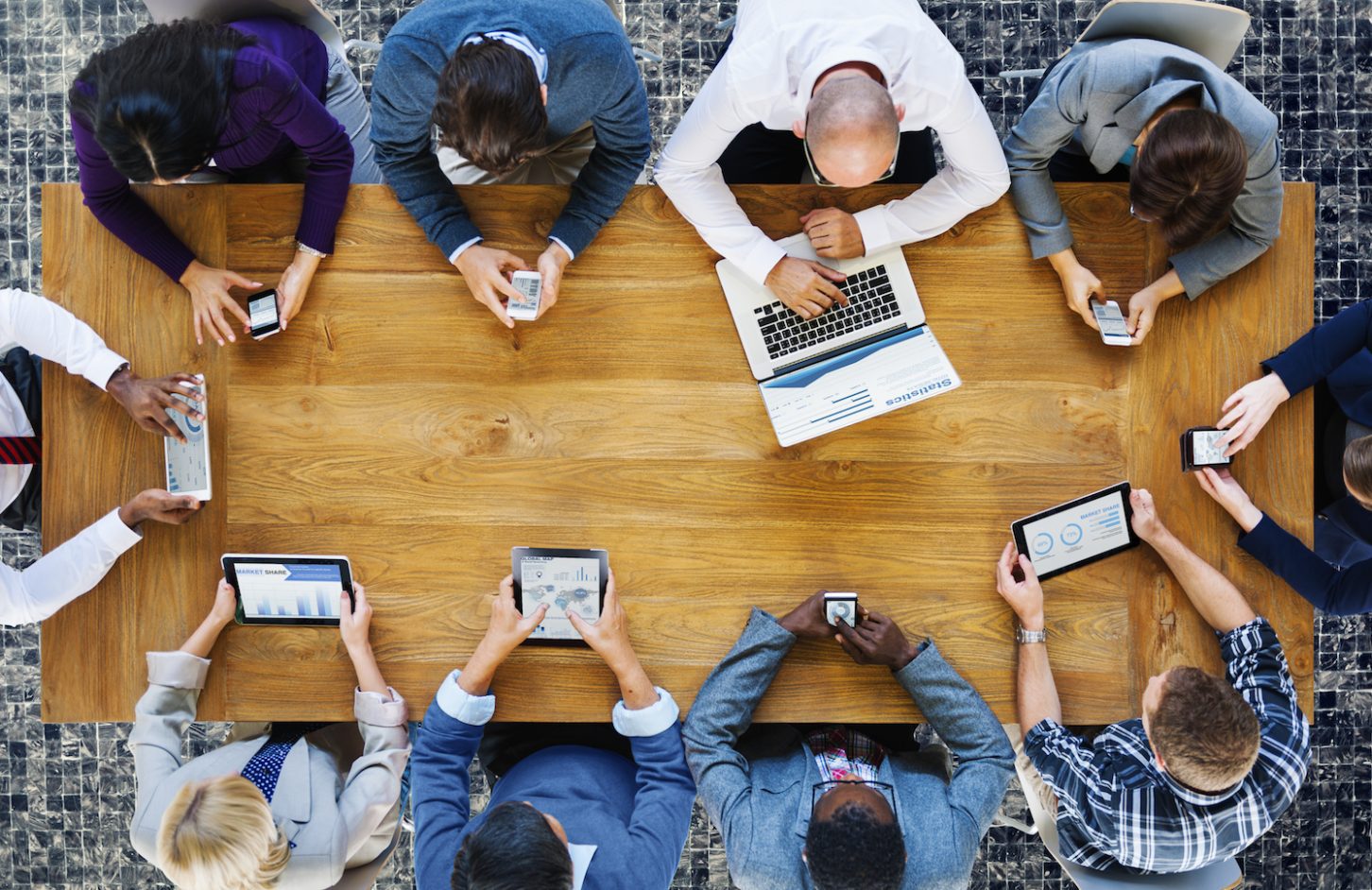 tech users round a table